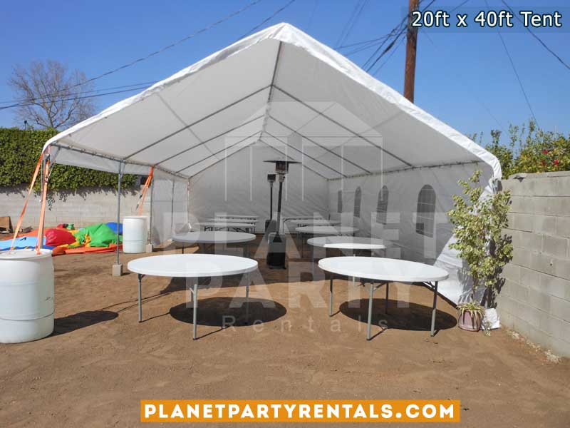 20x40 Tent with window sidewalls and round tables and patio heaters 
