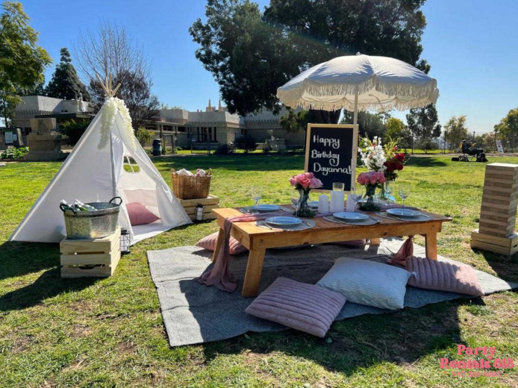Picnic Setup at the Park with Teepee, Pillows, Table Setup for Brunch, Flower Arrangements and Refreshments